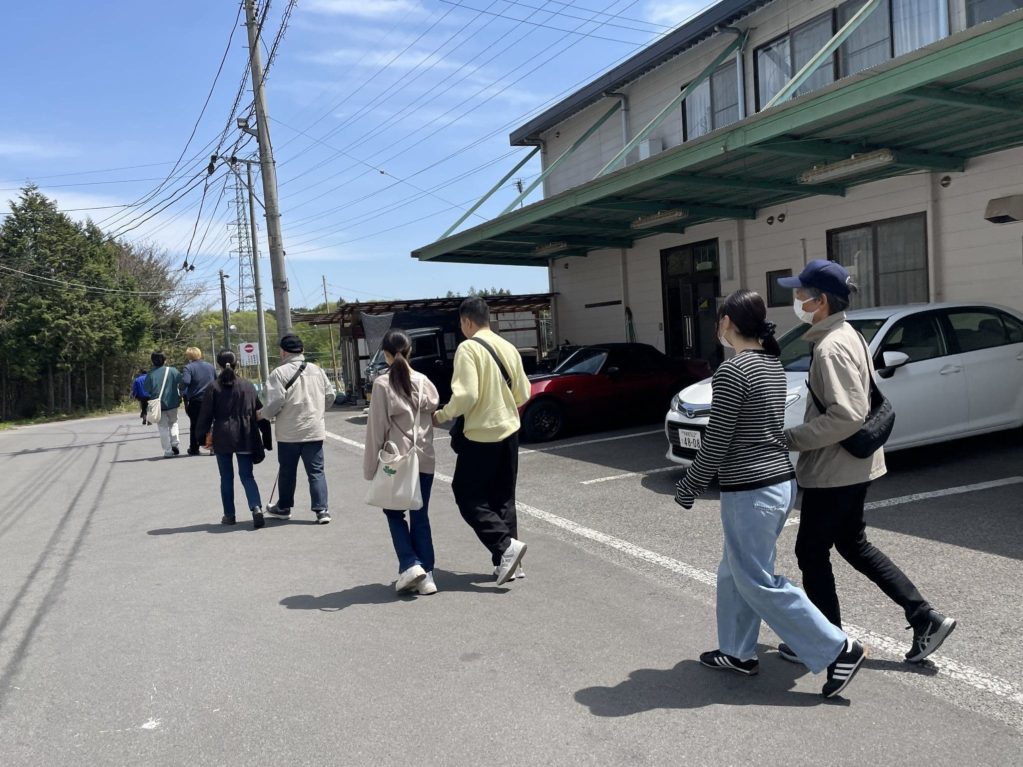 8枚目の写真は、2026年4月19日に開催された自動車運転体験ツァーでの運転体験の様子（栃木県中部自動車学校にて）